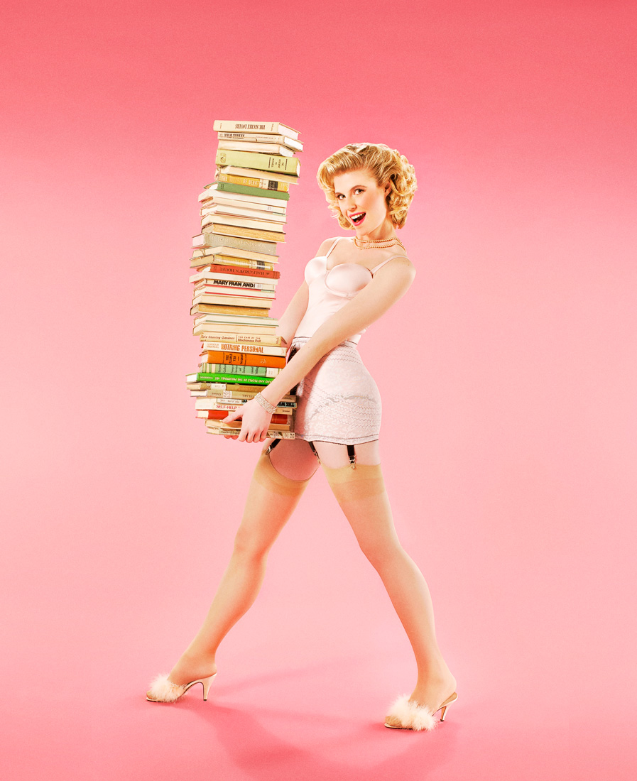Pin up girl with a tall stack of books | Conceptual Portrait by Saverio Truglia