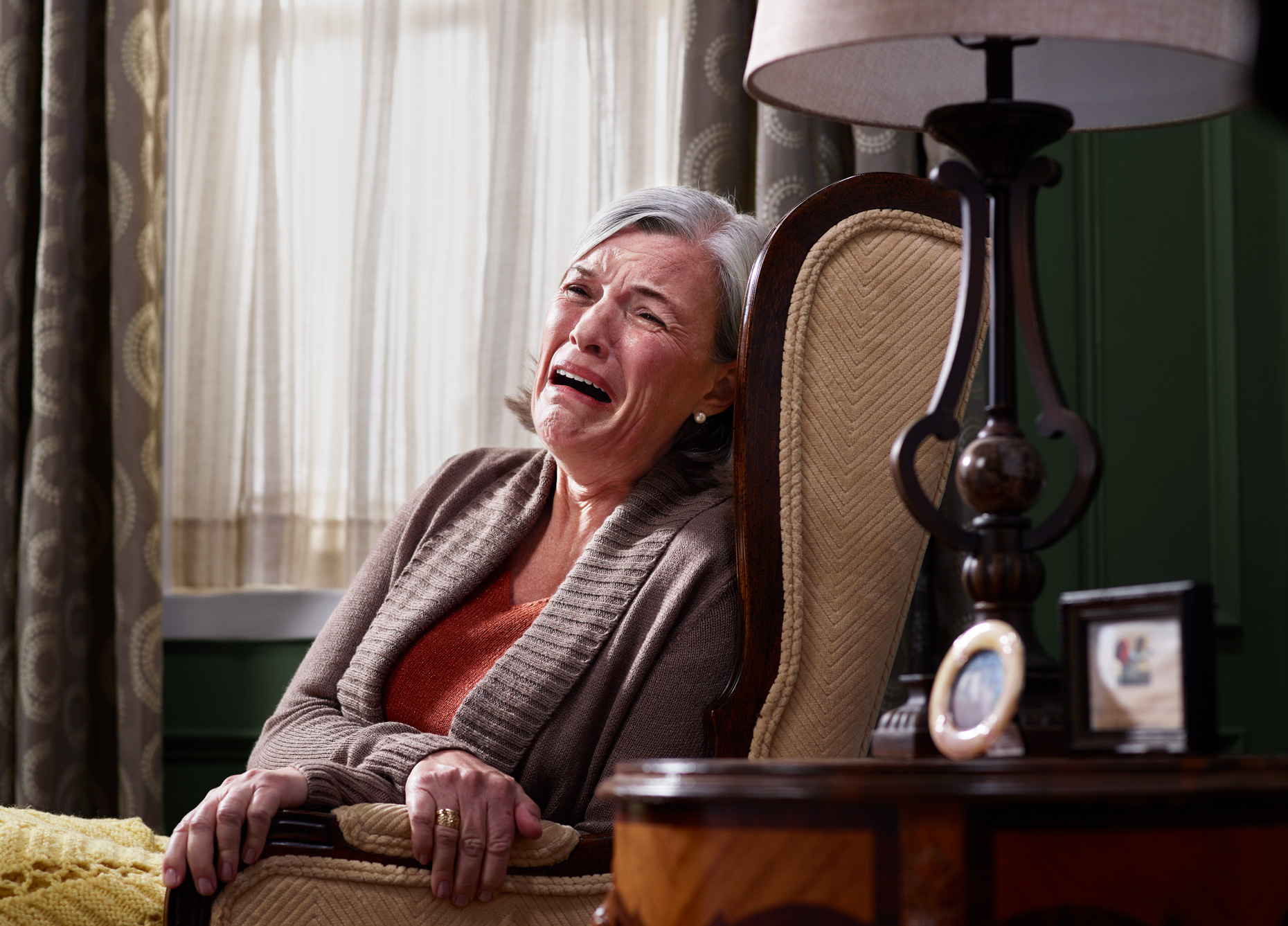 Older woman crying in livingroom | Conceptual portrait by Saverio Truglia