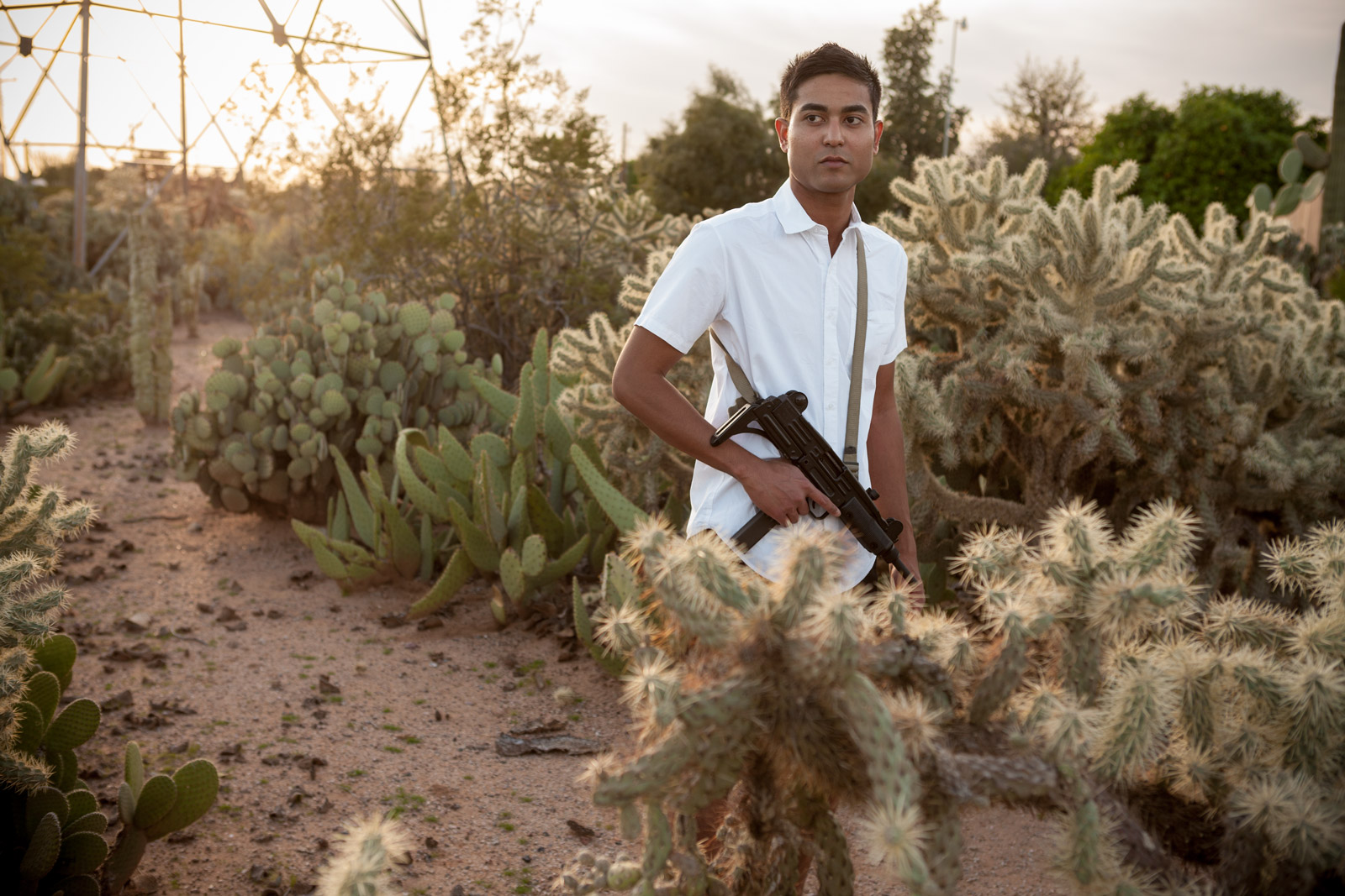 Man with assault weapon in desert | Saverio Truglia