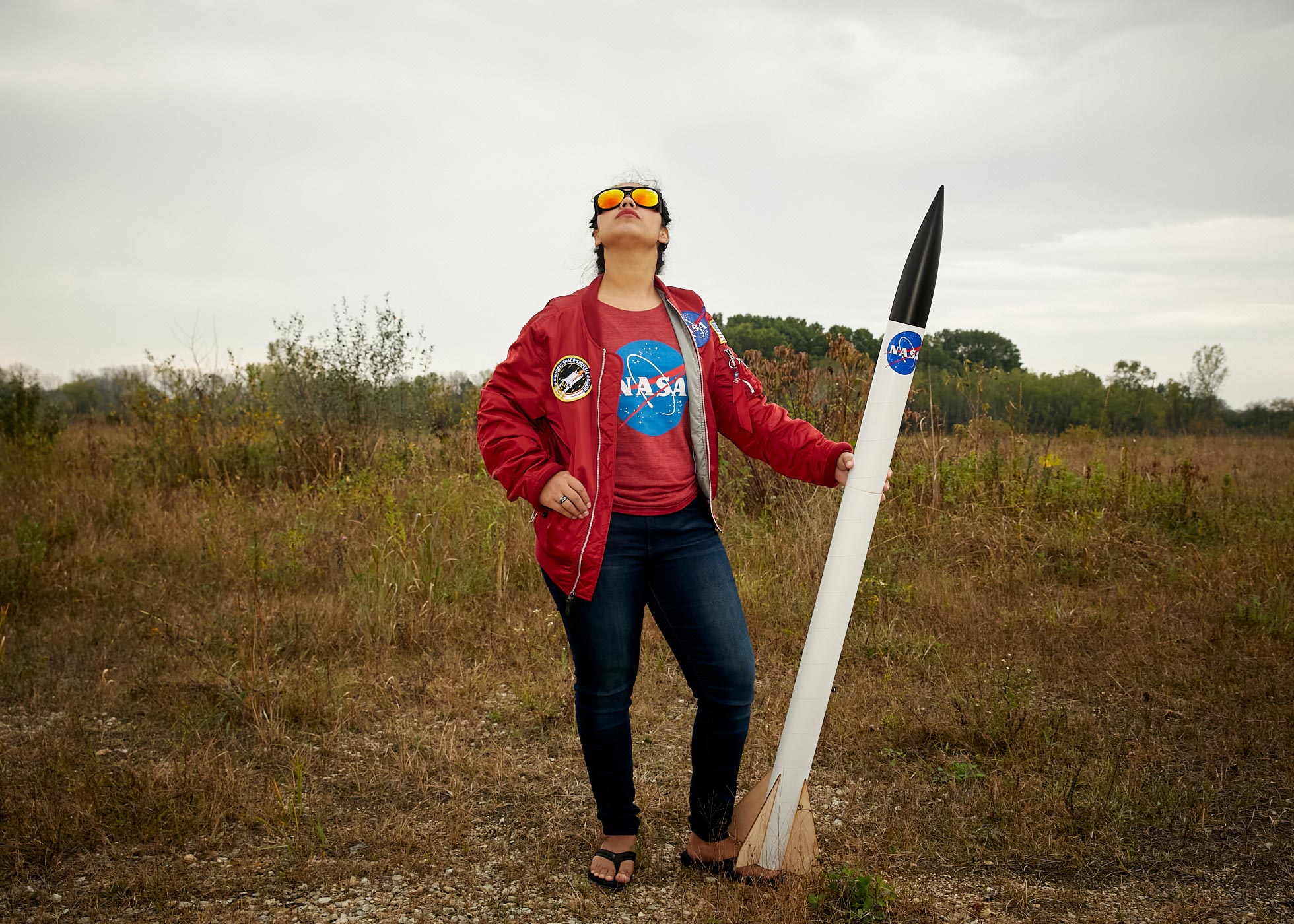 Native American woman with NASA branded model rocket | Saverio Truglia