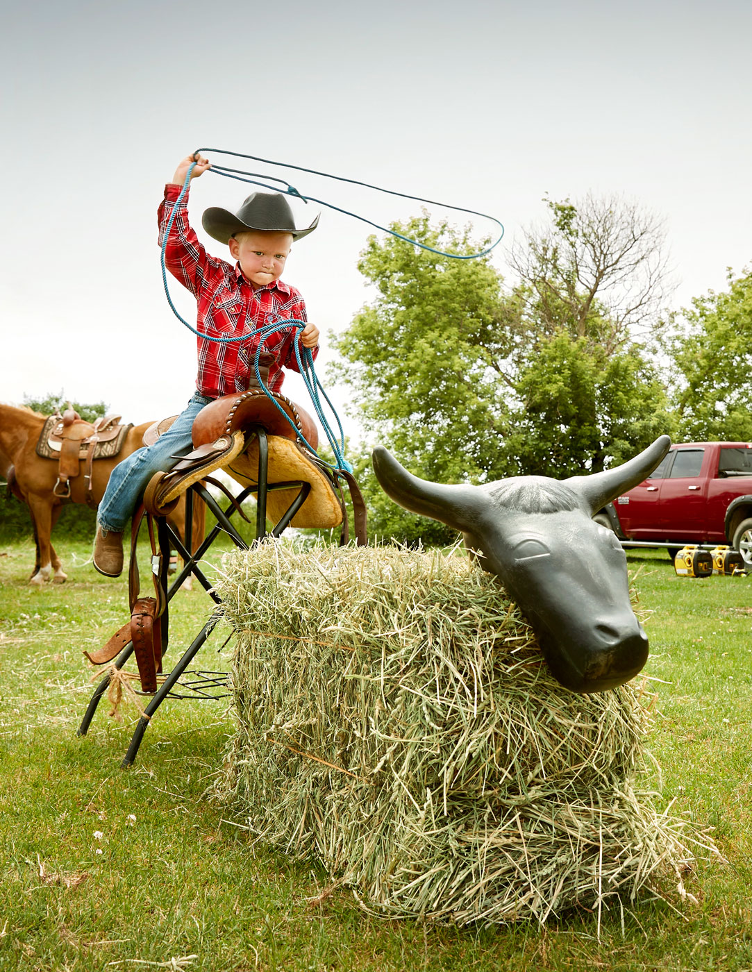 Boy practicing roping at rodeo | Childrens photography by Saverio Truglia