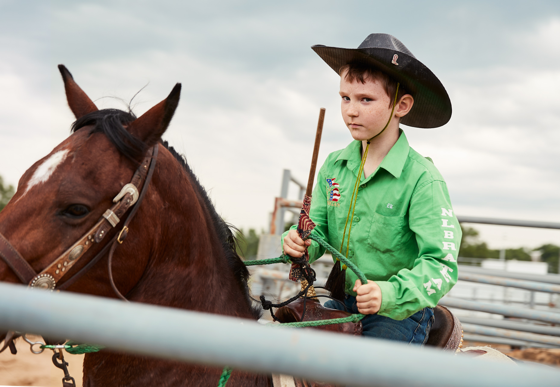 Boy glaring at rodeo competition | Childrens photography by Saverio Truglia