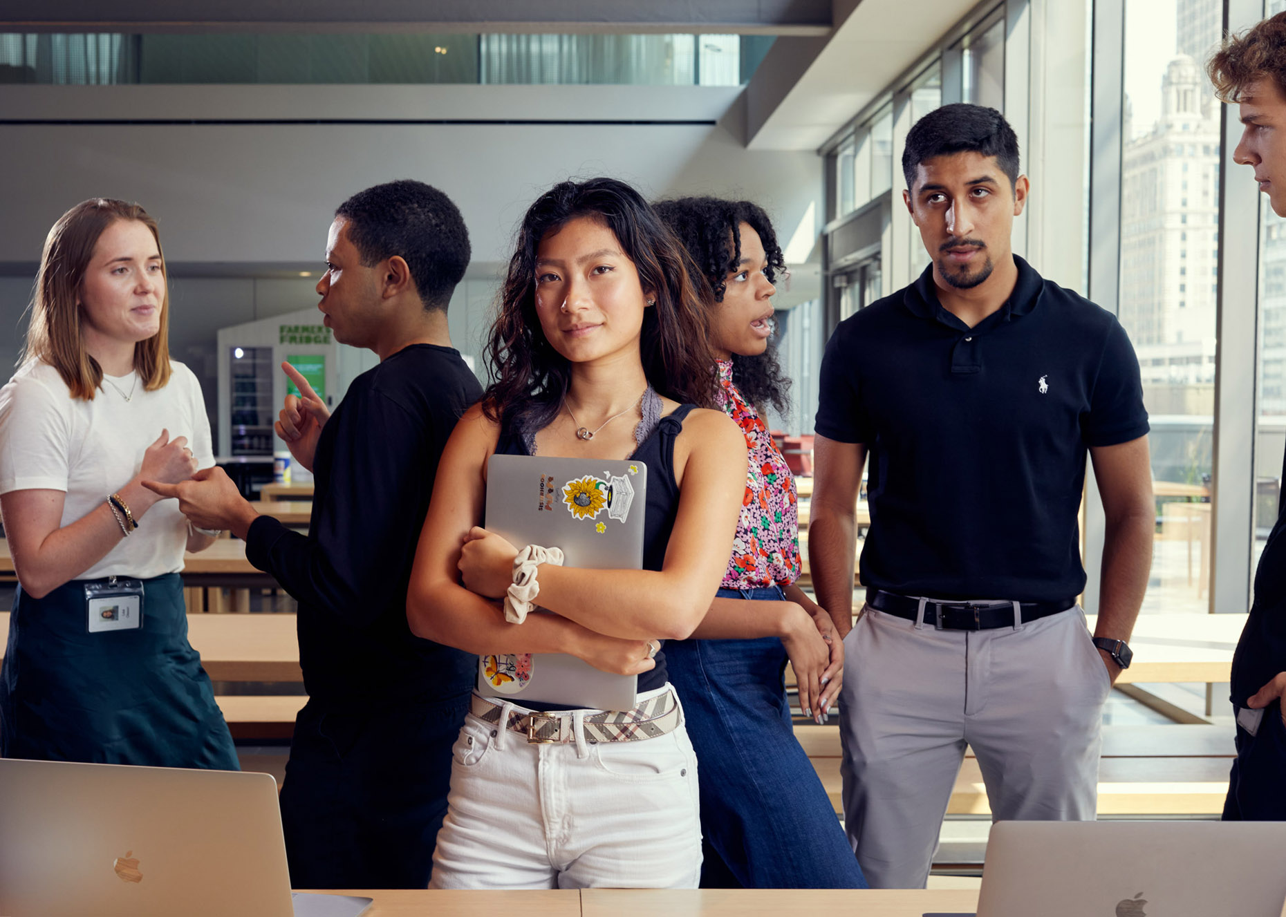 Asian student student standing among colleagues | lifestyle photography by Saverio Truglia