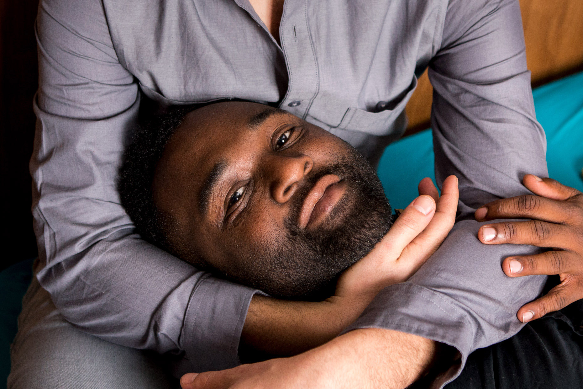 Black man being held by his white partner | lifestyle photography by Saverio Truglia