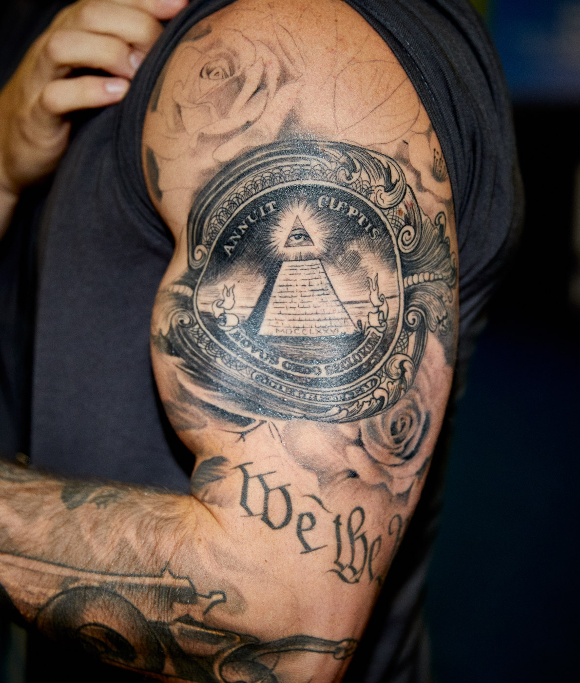 Money tattoo on muscular arm | Saverio Truglia